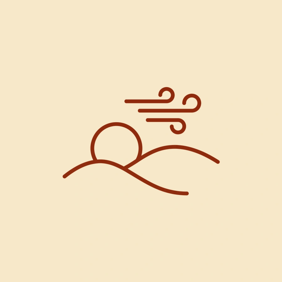 Pictogramme : un soleil bas sur des collines et du vent